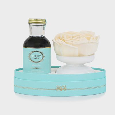 Hand-blown glass vase diffuser set in mystic rose tones displayed in a home setting with natural light