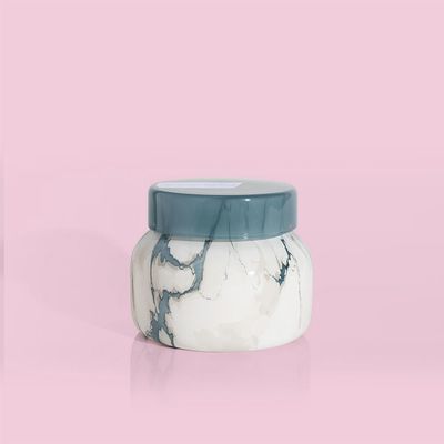 Capri Blue Volcano candle in an 8-ounce jar with modern marble finish, isolated on white background