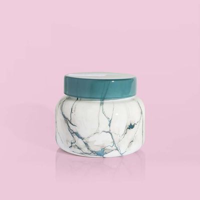 Capri Blue Volcano candle in a modern marble-textured signature jar, 19 ounces, displayed against a neutral background