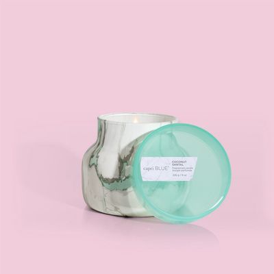 Capri Blue Coconut Santal 8 oz petite jar candle with marble-patterned ceramic vessel on white background