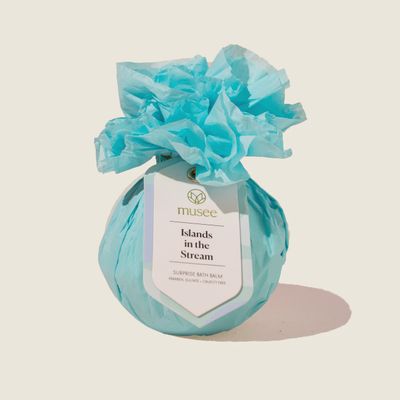 Musee Islands In The Stream mandarin peony bath balm with matching beaded bracelet on white background