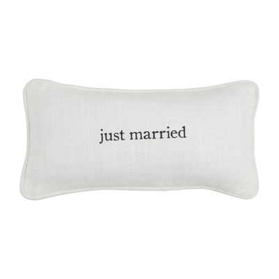 White decorative mini pillow with Just Married text, displayed against a neutral studio background