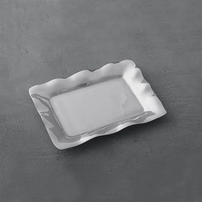 Beatriz Ball rectangular aluminum serving tray displayed in a lifestyle setting, showcasing the polished metal finish and clean geometric form