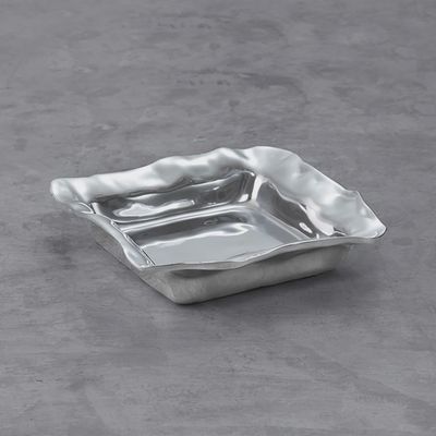 Beatriz Ball Vento napkin box in hand-polished aluminum, displayed against a neutral background in studio lighting