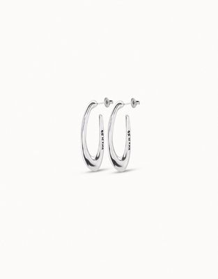 Pair of Uno de 50 Do You Orbit silver-plated oval earrings displayed against a neutral background in studio lighting