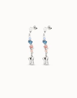 Uno de 50 Metamorphosis butterfly crystal drop earrings worn in a lifestyle setting, showcasing the delicate crystal pendant details