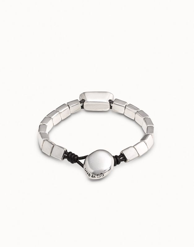 Uno de 50 Anaconda bracelet in silver plating with gray crystal detail, worn on wrist in lifestyle setting
