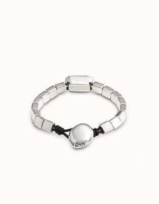 Uno de 50 Anaconda bracelet in silver plating with gray crystal detail, worn on wrist in lifestyle setting