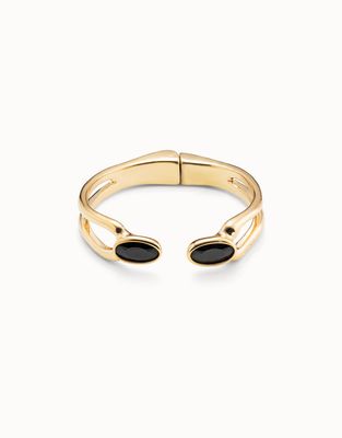 Gold-plated open bracelet with black crystal stone detail on white background