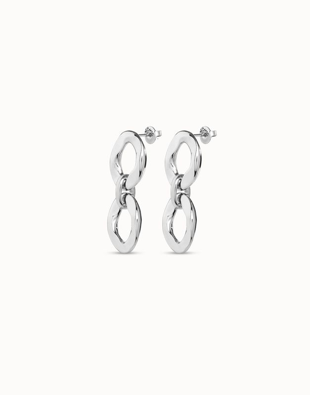 Handcrafted silver two-link earrings from Uno de 50 displayed in a lifestyle setting, showcasing the artisanal metalwork and polished finish