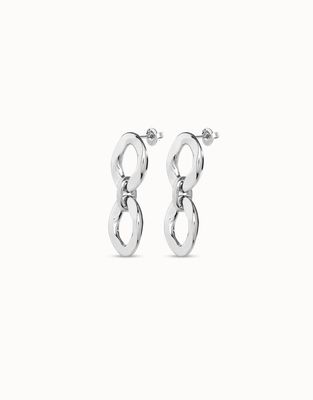 Handcrafted silver two-link earrings from Uno de 50 displayed in a lifestyle setting, showcasing the artisanal metalwork and polished finish