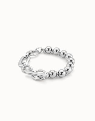 Silver beaded bracelet with ring and bar clasp closure on white background