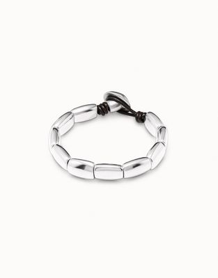 Uno de 50 Petals silver-plated artisan bracelet displayed against a neutral background, showing intricate petal detailing and metalwork.