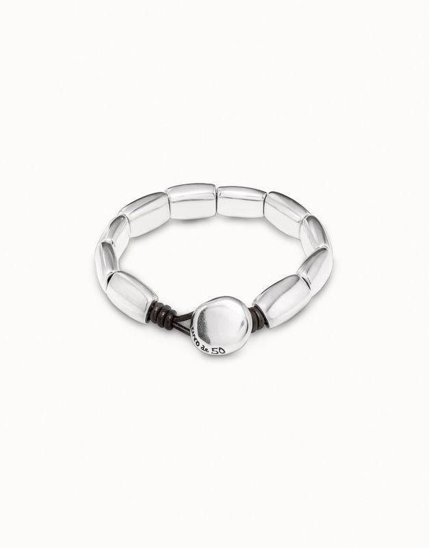 Silver-plated Petals artisan bracelet by Uno de 50 worn on wrist in lifestyle setting, showing detailed metalwork and sculptural design