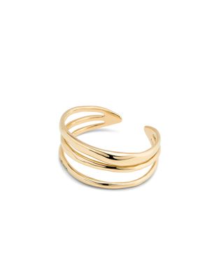Uno de 50 Electrik triple rigid bracelet in 18K gold plating, displayed against a neutral studio background