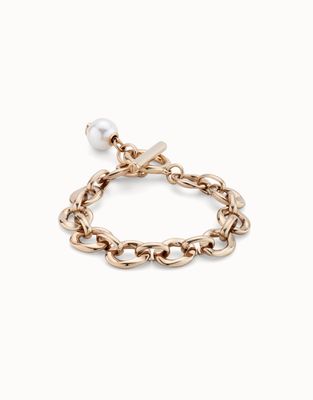 Uno de 50 Yolo Pearl Charm Bracelet with engraved You Only Live Once message, displayed on wrist in lifestyle setting