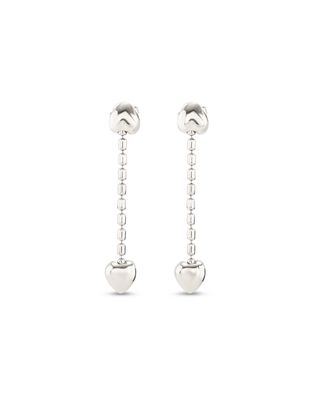 Uno de 50 Cupido heart earrings with ornate metalwork detail on neutral studio background
