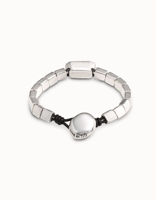 Silver-plated Anaconda bracelet with white crystal detail worn on wrist in lifestyle setting
