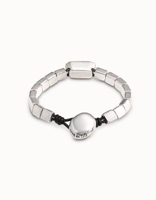 Silver-plated Anaconda bracelet with white crystal detail worn on wrist in lifestyle setting