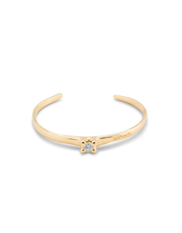 Uno de 50 Cosmos bracelet with white and blue crystals, silver and gold mixed metals, worn in a lifestyle setting