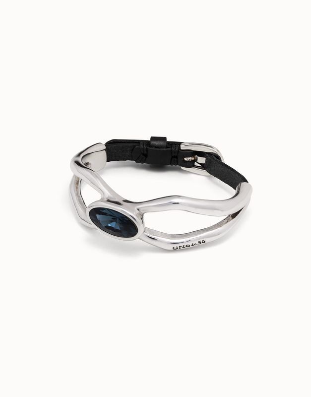 Silver-plated Lord bracelet with blue crystal detail and dark leather strap, worn as wrist accessory.