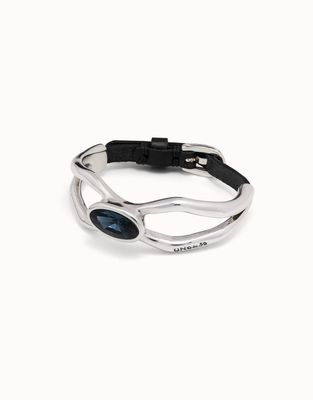 Silver-plated Lord bracelet with blue crystal detail and dark leather strap, worn as wrist accessory.