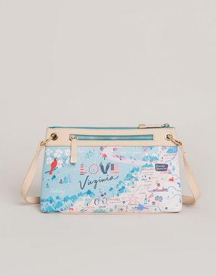 Virginia textured vinyl crossbody bag in a lifestyle setting, showing the bag's tactile surface and structured silhouette.