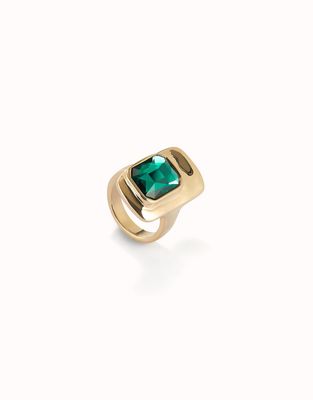 18K gold-plated ring by Uno de 50 featuring a polished green crystal stone set in sculptural metalwork against a neutral background