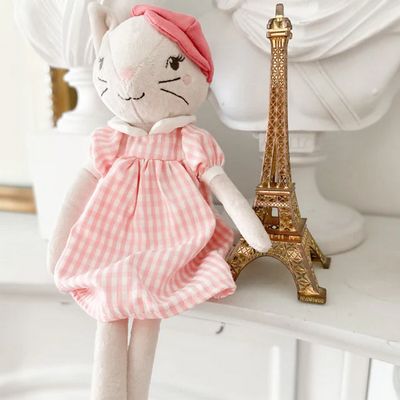 Mon Ami Minette Parisian Kitty plush toy, a 13-inch velour cat in soft gray tones, positioned in a lifestyle setting