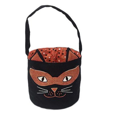 Orange Mon Ami cat-shaped Halloween trick-or-treat bag with dot print liner, displayed against a white background