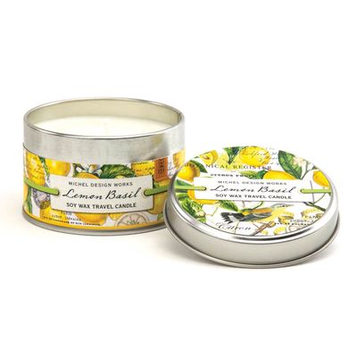 Michel Design Works Lemon Basil soy wax candle in a silver metal tin, studio shot on white background
