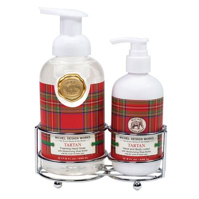 Red and green tartan holiday hand care caddy set by Michel Design Works displayed against a white background