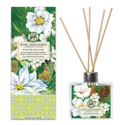 Michel Design Works Winter Blooms reed diffuser with glass decanter and reed sticks on white background