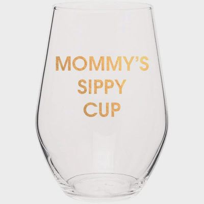 Gold foil wine glass with Mommy's Sippy Cup text printed on white ceramic, shown against a neutral studio background