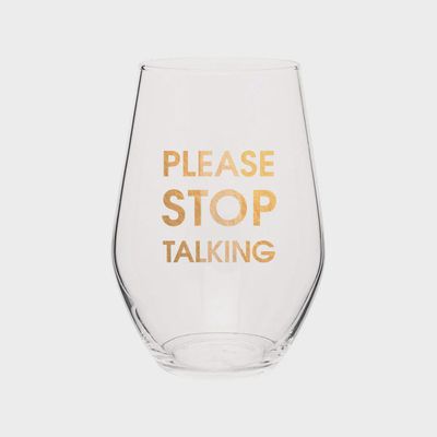 Clear wine glass with gold foil text reading 'Please Stop Talking' on a white background
