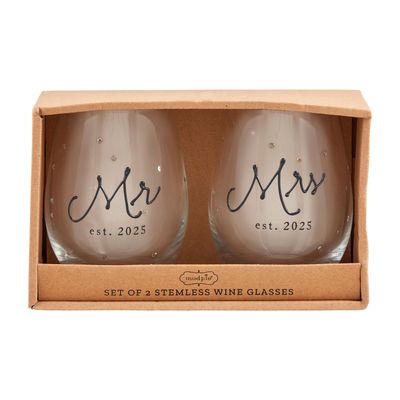 Two clear glass cups with Mr. and Mrs. Est. 2025 text printed on white background, displayed together on neutral studio surface