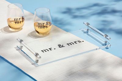 Clear acrylic serving tray with Mr &amp; Mrs text and handles, styled in a wedding tablescape setting