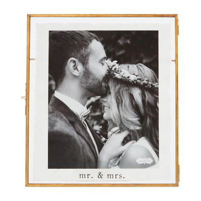 Decorative glass frame with Mr. and Mrs. text, isolated on white background in studio setting