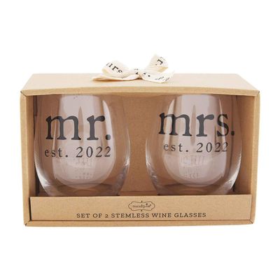 Two clear wine glasses with Mr. and Mrs. etched text, displayed side by side on a white background