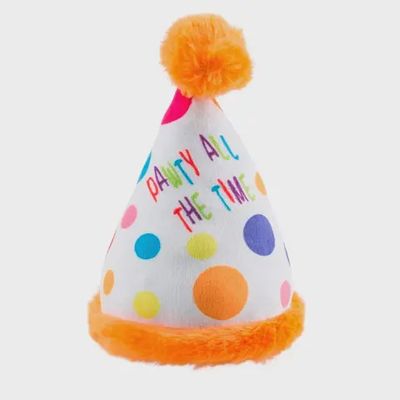 Pink and white plush dog toy with squeaker in the shape of a birthday party hat, isolated on white background