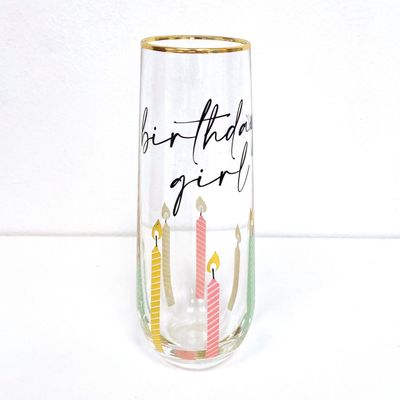 Clear stemless champagne glass with Birthday Girl text printed on front, photographed against white background in studio lighting