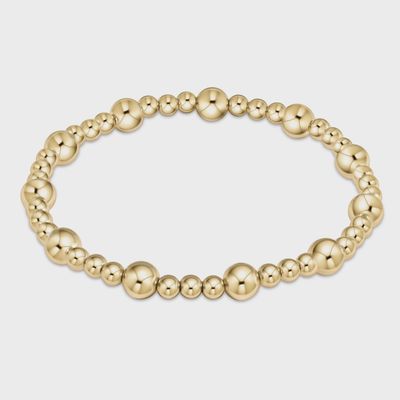 14kt gold-filled beaded bracelet with 6mm round beads on a neutral background, 6.75 inch circumference