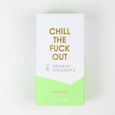 Set of eight eucalyptus shower steamers in white and green, arranged on a neutral background