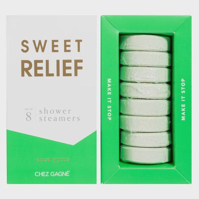 Eight eucalyptus shower steamers from Sweet Relief by Chez Gagne arranged in a studio product display