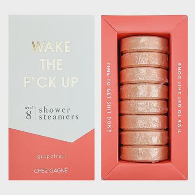 Set of eight grapefruit shower steamers in cardboard packaging against a clean white background