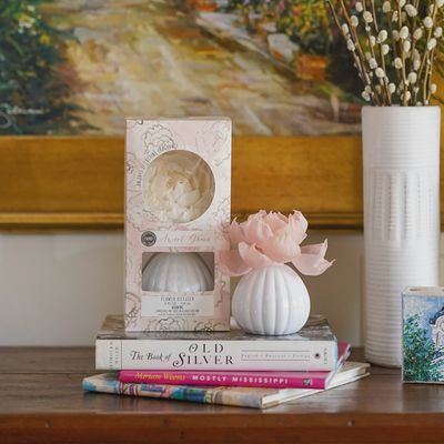 Bridgewater Candle Sweet Grace Blooming Flower Diffuser displayed on a wooden surface with fresh flowers nearby