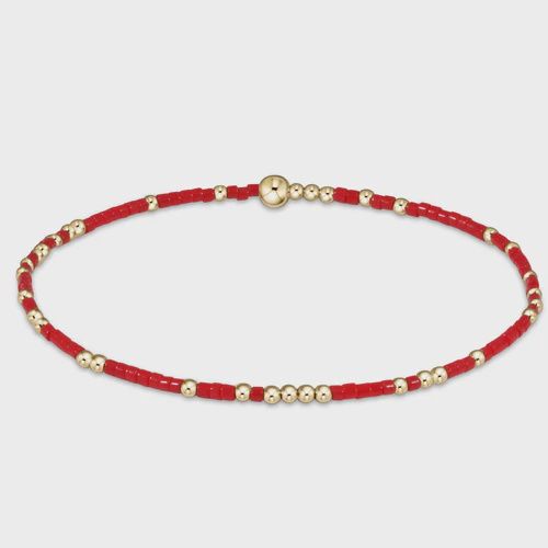 eNewton Hope Unwritten bracelet in 14k gold-filled displayed on a wrist in a lifestyle setting