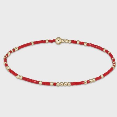 eNewton Hope Unwritten bracelet in 14k gold-filled displayed on a wrist in a lifestyle setting