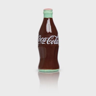 Nora Fleming Coke bottle mini decorative collectible in studio setting on white background