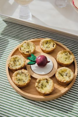 Nora Fleming radish mini decorative tabletop accent displayed on a styled surface with table setting elements